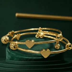 Twin Hearts Gold Bangles for Women with Crystal Detailing and Bell Charms